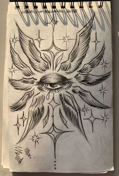 a drawing of an eye with wings and stars