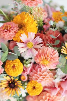 a bunch of flowers that are sitting on a table