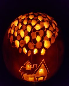 a pumpkin carved to look like it has been carved into the shape of a house