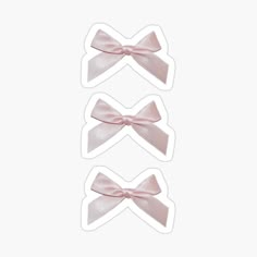 three pink bows on white stickers with one bow at the top and two in the middle