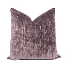 a purple velvet pillow on a white background