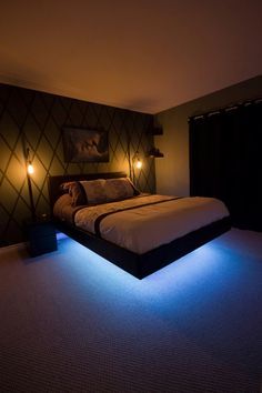 a bed with two lights on each side of it