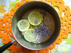 lemons and lavender in a bowl on a table