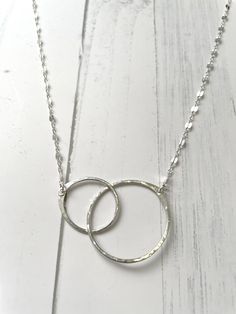 *Dainty and simple 14k gold filled and sterling silver necklace.  *The Soul Mate necklace has two interlocking hammered circles linked together to represent the deep connection you and your soul mate or twin flame from Past, Present, or Future.  The two textured rings are hand made, large and small, represent LOVE and connection. It can also to used  as a manifesting tool to attract a love, soul mate, or your twin flame into your life ❤️. Soulmates Best Friends, Soulmate Necklace, Necklace Infinity, Deep Connection, Soul Mate, Infinity Necklace, Textured Ring, Hammered Gold, Twin Flame