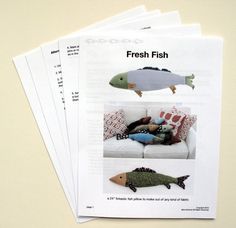 four books with pictures of fish on them