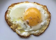 an egg is on top of some bread