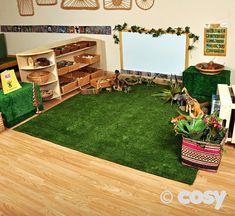 a room with green carpet and toys in it