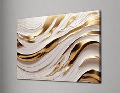 an abstract gold and white painting on the wall