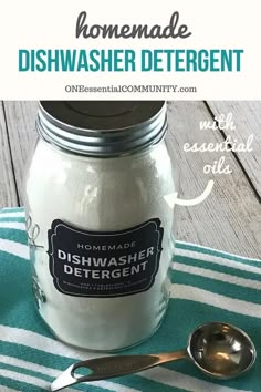 homemade dishwasher deterent in a mason jar with a spoon on the side