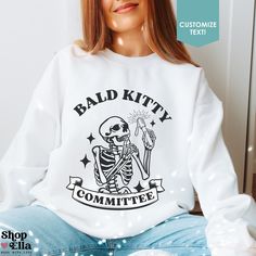 Bald Kitty Committee - The perfect spooky skeleton shirt for a stylish wax specialist! Add your own personalization or customize the phrase. Choose from our cozy heavy blend Gildan® sweatshirts, hoodies, or the soft Airlume combed/ring-spun Bella Canvas® t-shirts (heather t-shirts are made from a soft cotton-poly blend).  📦 𝐇𝐎𝐖 ��𝐓𝐎 𝐎𝐑𝐃𝐄𝐑: ------------------------------------------------------------------ 1️⃣ Select product style, color & size from the dropdown boxes next to the image ( Esthetician Clothing, Waxing Funny Humor Hair Removal, Esthetician Shirts, Esthetician Apparel, Wax Specialist, Skeleton Hoodie, Spooky Skeleton, Merch Ideas, Wax Hair Removal