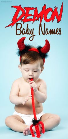 a baby sitting on the floor wearing devil horns and holding a toothbrush in it's mouth