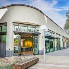 the entrance to nappa valley dental center on a sunny day with flowers in front