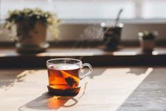 a cup of tea sitting on top of a table