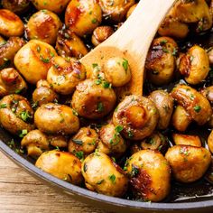 a skillet filled with cooked potatoes and garnished with parsley