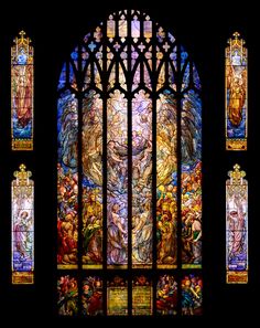 an ornate stained glass window depicting the birth of jesus