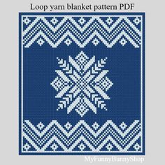 a blue and white cross stitch pattern with snowflakes in the center, on a gray background