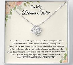 an open heart necklace in a box with the message to my bunus sister on it