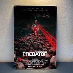 the predator movie poster is displayed on a wall