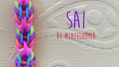 a rainbow colored braid on top of a white background with the words sati written above it