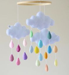 a mobile with clouds and rain drops hanging from it