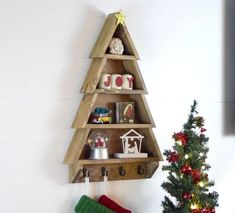 DIY CHRISTMAS TREE SHELF WOODWORKING PLAN This post will show you how to make your own DIY Christmas Tree Shelf! This little tree shelf is the perfect place for little nick-knacks and special things. We also hang our stockings on here, and you guys, it looks SO pretty! Easy for everyone! Instant Download Tree Shelf Diy, Diy Wooden Tree, Christmas Tree Shelf, Woodworking Plans Shelves, Tree Christmas Decoration, Tree Shelf, Shelf Diy, Wooden Christmas Tree, Wooden Tree