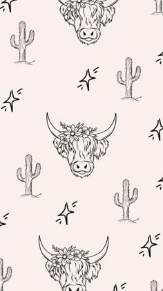 a cow with flowers on it's head and cactus in the background