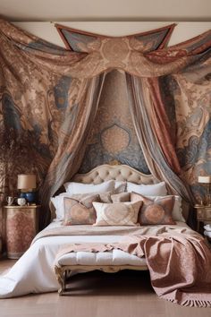 a large bed sitting under a canopy in a bedroom