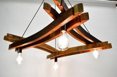 a wooden chandelier with light bulbs hanging from it