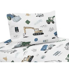 a bed with construction themed sheets and pillow cases