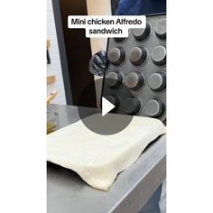 an image of a person making food in the kitchen with text overlay that reads mini chicken alfredo sandwich