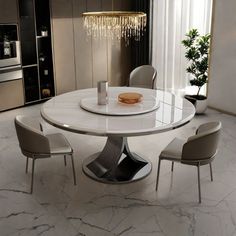 a white table with four chairs around it in a room that has marble floors and walls