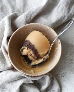 an ice cream dessert in a bowl with a spoon