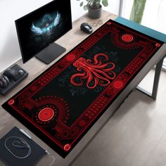 a computer desk with an octopus rug on it