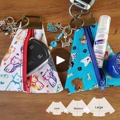 three purses with keychains, keys and other items laid out on a table