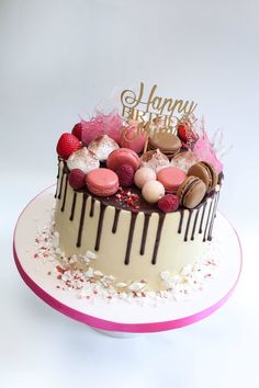 a birthday cake with chocolate frosting and candies