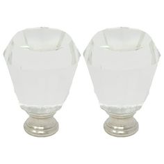 pair of white glass knobs with metal base