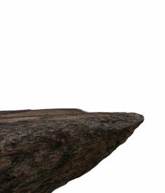 a man standing on top of a large rock