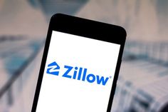 the zillow logo is displayed on a smartphone screen in front of an abstract background