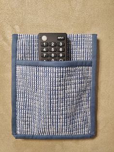 a pocket with a calculator sticking out of it