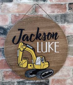 a wooden sign hanging on the side of a brick wall that says, jackson like