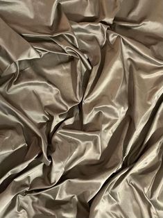 a close up view of a shiny silver fabric