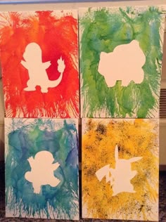 four handmade cards with different colored silhouettes on them