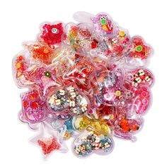 a pile of assorted candy candies sitting on top of each other