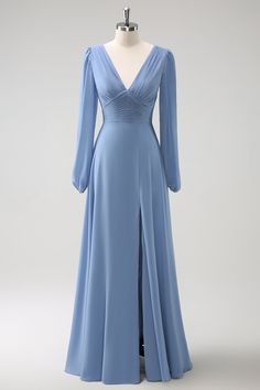 a dress on a mannequin with long sleeves and a slited neckline