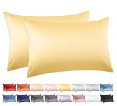 two pillows and one pillow case with different colors on them, all side by side