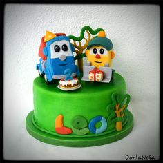 a green cake with two cartoon characters on it