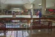 the inside of a restaurant with tables and chairs in it's center aisle area