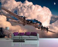 an airplane is flying through the clouds with lightning in the sky behind it and purple pillows on the floor