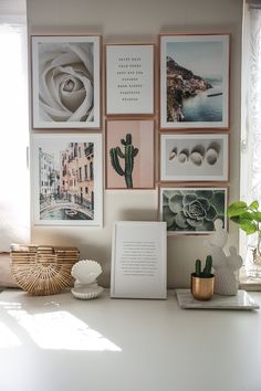 a white table topped with pictures and plants