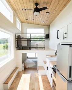 this tiny house has stairs leading to the loft